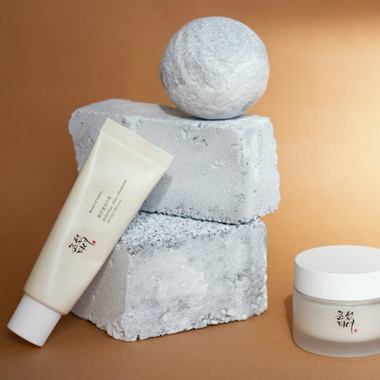 a bottle of lotion, a tube of cream, and a ball of soap