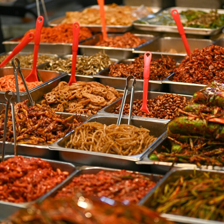 A Korean table with rice, soup, kimchi and seasonal vegetable side dishes