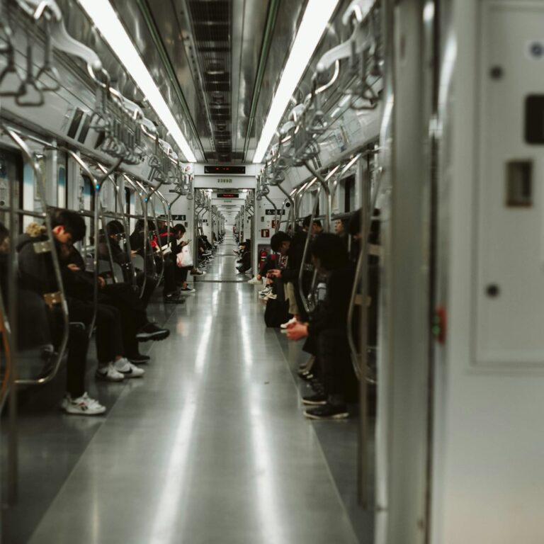 Passengers seated inside a Seoul subway car