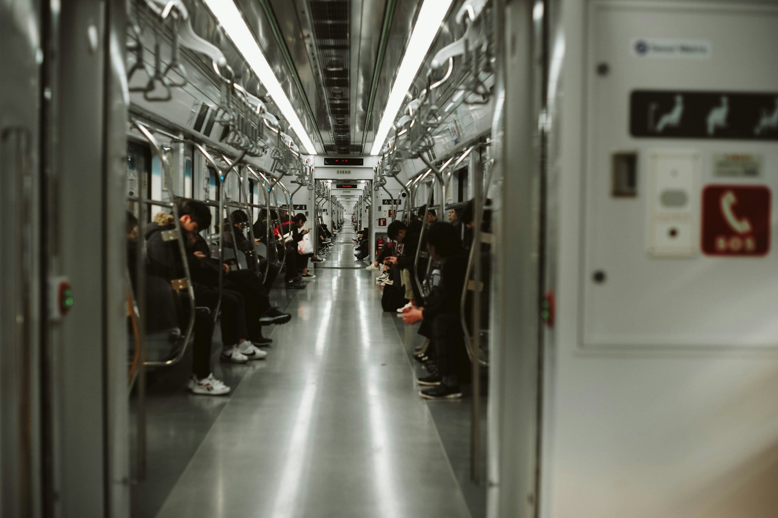 Passengers seated inside a Seoul subway car